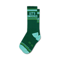 Pair of dark green crew socks with 'Let's Snuggle' in white text and teal and lime green stripes at the top and bottom.