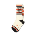 Pair of off-white crew socks with black and orange stripes. Text 'Horny For Thrift Stores' is vertically stacked on the socks.