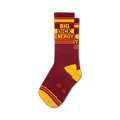 Pair of maroon crew socks with yellow and orange stripes.  The socks feature the text 'BIG DICK ENERGY' in a retro style.