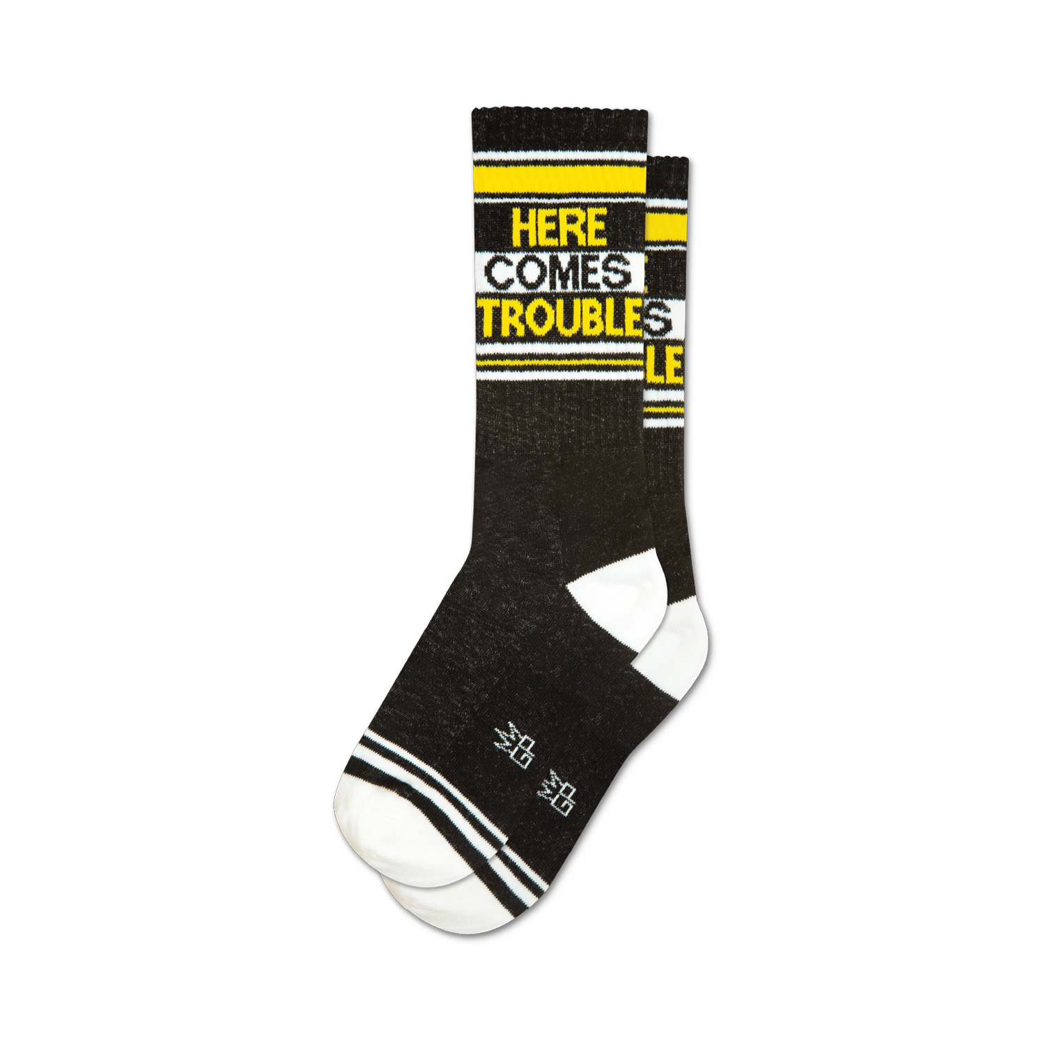 Pair of black crew socks with yellow and white stripes and the text 'HERE COMES TROUBLE' in yellow.