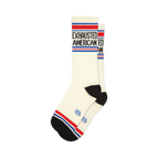 Pair of cream crew socks with 'Exhausted American' text in black, accented by red and blue stripes at the top and bottom.