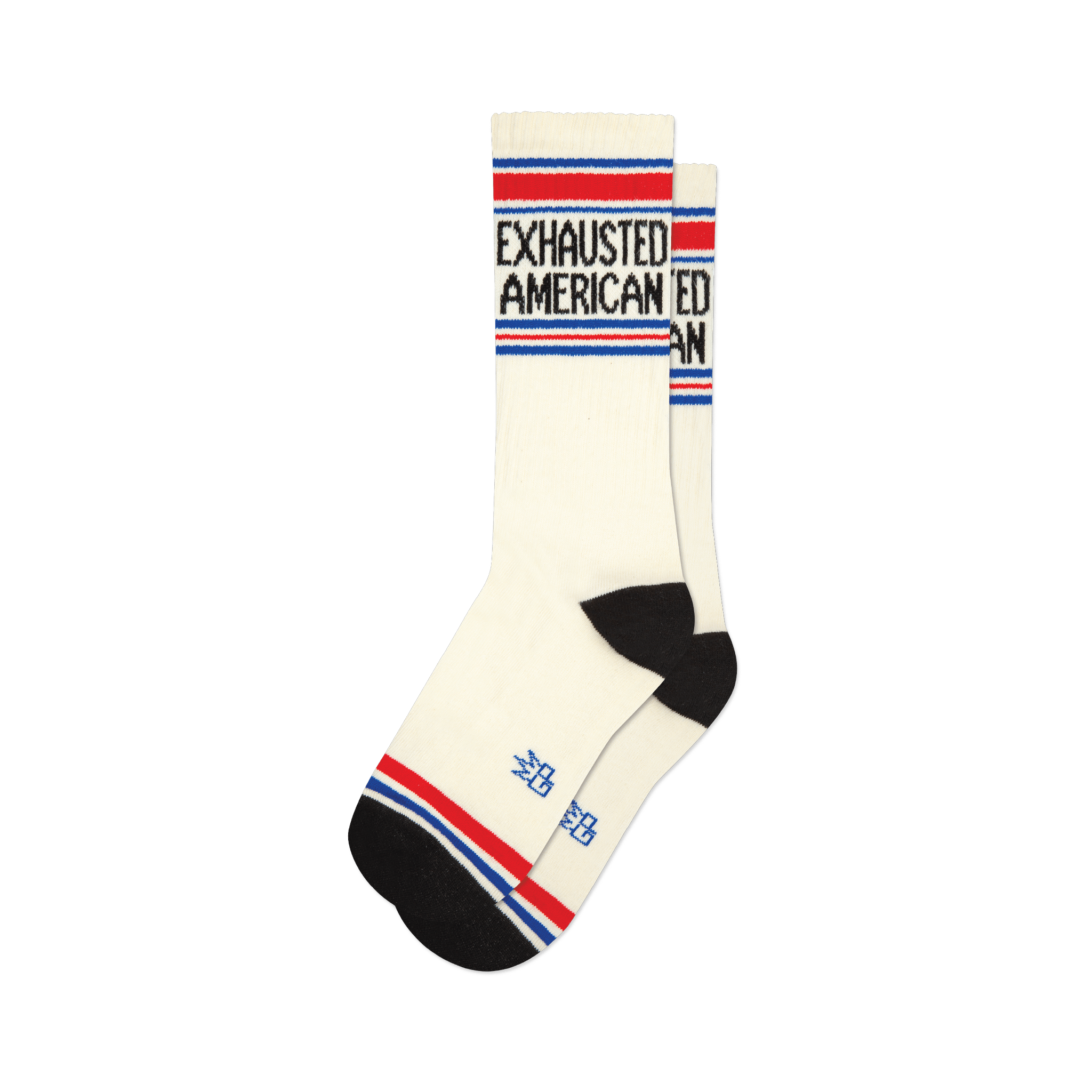 Pair of cream crew socks with 'Exhausted American' text in black, accented by red and blue stripes at the top and bottom.