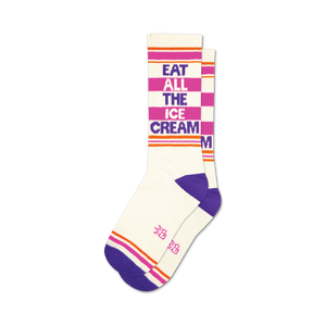 unisex white crew socks with purple toes, heels, and cuffs, 2 orange stripes, and 'eat all the ice cream' in purple and pink.   