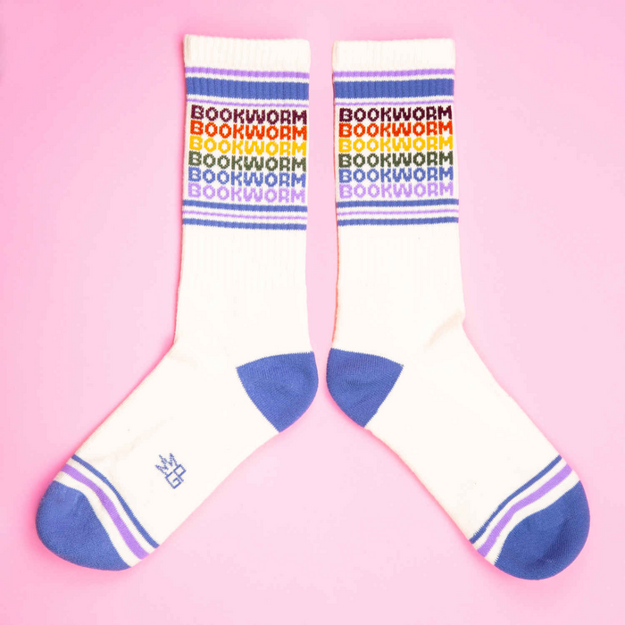 A pair of white socks with the word 