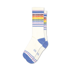 Pair of white crew socks with rainbow-colored 'Bookworm' text and purple and blue stripes at the cuff.