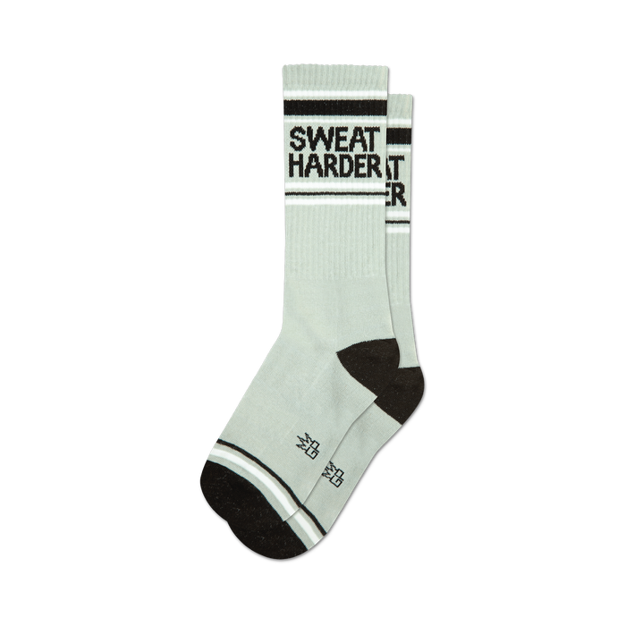 a pair of gray socks with the words 'sweat harder' on them. }}