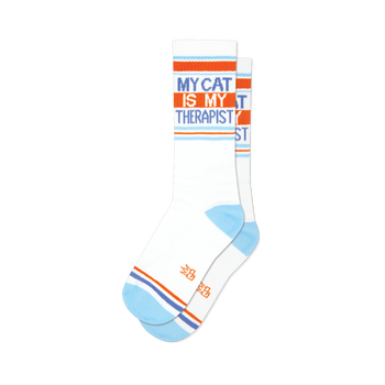Pair of white crew socks with orange and light blue stripes and the text 'My Cat Is My Therapist'.