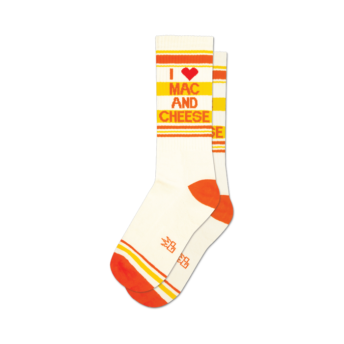 socks that are white with red and orange stripes at the top and bottom. the words 'i heart mac and cheese' are written on the front of the socks in red and orange letters. }}