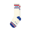 Pair of off-white crew socks with red, white, and blue stripes at the top and bottom. The word VOTE is prominently displayed on the socks.