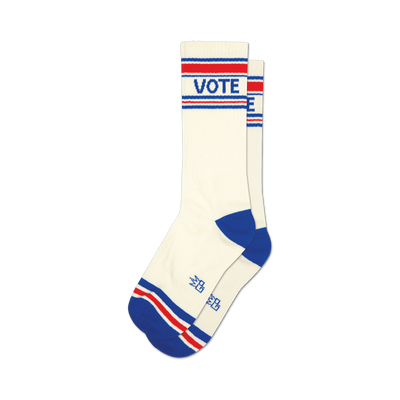 a pair of white socks with red and blue stripes at the top and the word 'vote' in large blue letters on the front.