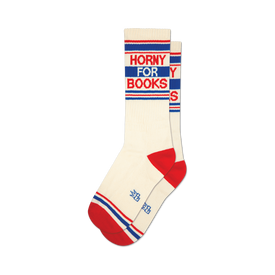 a pair of socks with the words 'horny for books' on them. socks that are white with red and blue stripes at the top and red heels and toes.