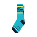 Pair of teal blue crew socks with navy and neon yellow stripes.  The socks feature the text 'Buh Bye Doubters' in a bold font.