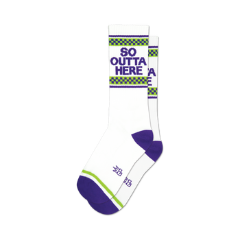 socks that are white with purple toes, heels, and cuffs. there is a green and white checkered pattern above the purple cuff. the words 'so outta here' are printed in purple block letters on the front of the socks.