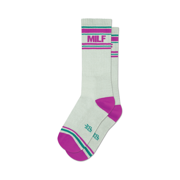 socks that are white with a pink and green stripe at the top and a pink toe and heel. the word 'milf' is written in large purple letters on the front of each sock. }}