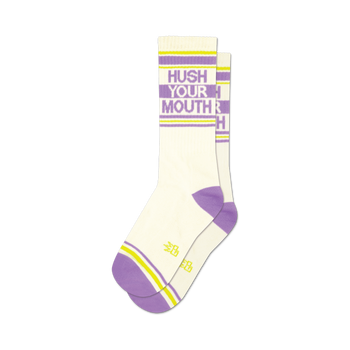 a pair of socks with the text 'hush your mouth' on them.