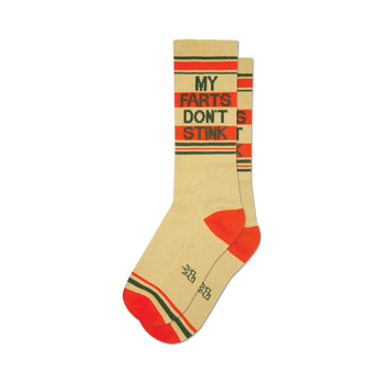 socks that are cream-colored with red and green stripes at the top and bottom. the words 'my farts don't stink' are written in the middle of each sock in brown and green.