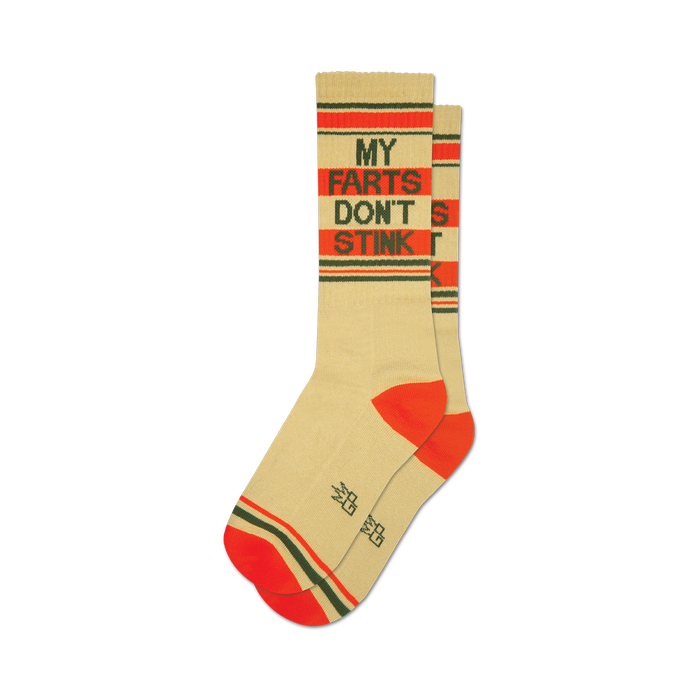 socks that are cream-colored with red and green stripes at the top and bottom. the words 'my farts don't stink' are written in the middle of each sock in brown and green. }}