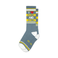 A pair of grey crew socks with yellow stripes and the text 'I ♥ AGING AND DYING' in yellow and red. 