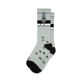 A pair of crew socks in light gray with a sitting gray tabby cat, black stripes, and scattered black paw prints.