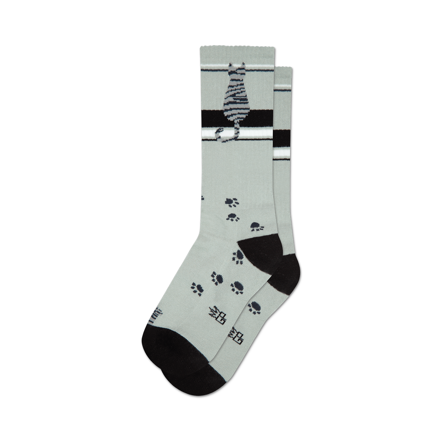 A pair of crew socks in light gray with a sitting gray tabby cat, black stripes, and scattered black paw prints.