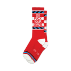 Pair of red crew socks with a bold 'Go Fuck Your Selfie' message in white and blue. Features blue and white stripes.