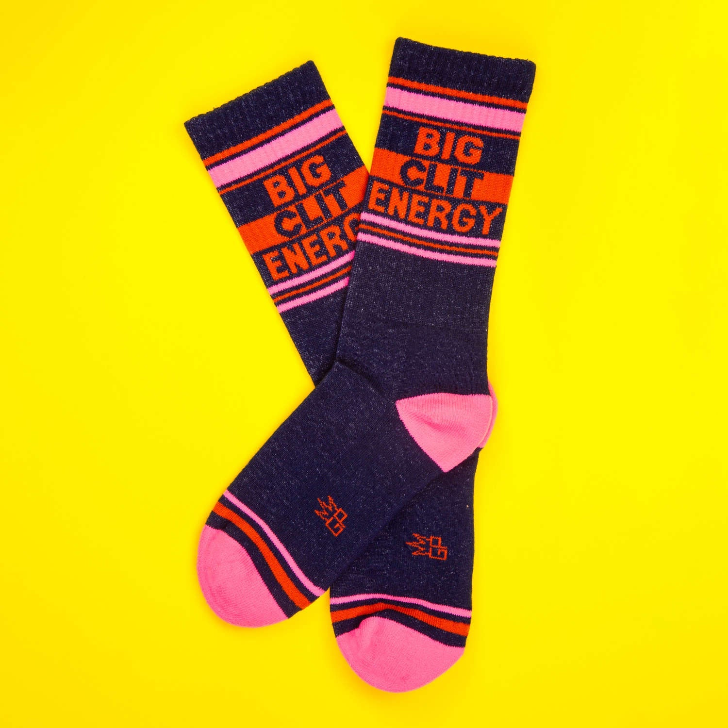 Flat lay of 'Big City Energy' socks on a yellow background. [lf]