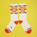 Lifestyle shot of 'Proud Gay Mom' socks on a foot (possibly a model). [lf]