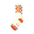 Cream crew socks with orange cuffs and toes.  'Proud Gay Mom' is printed in orange, accented by a rainbow heart border.