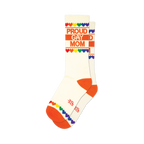 Cream crew socks with orange cuffs and toes.  'Proud Gay Mom' is printed in orange, accented by a rainbow heart border.