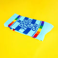 Folded 'In Dog Years I'm Gay' socks displayed on a yellow background. [lf]