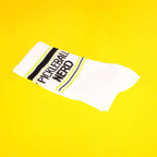 Close-up of a single Pickleball Nerd sock on a yellow background. [lf]
