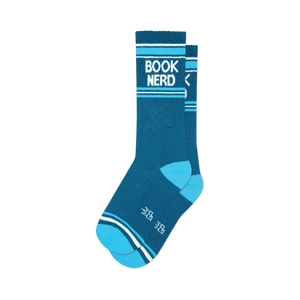 a close-up view of a pair of blue and white socks that say 'book nerd'.