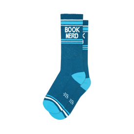 a close-up view of a pair of blue and white socks that say 'book nerd'.