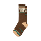 Pair of brown crew socks with a retro-style 'COFFEE NERD' graphic in cream and teal.  Features a peach-colored cuff.