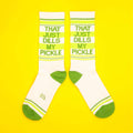 Another flat lay of the socks, showcasing the full design on a bright yellow background. [lf]