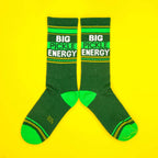 Another flat lay image, but socks are laid out in a more spread-out pose against a yellow background. [lf]