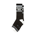 Pair of black crew socks with white and grey stripes and 'Museum Nerd' text.  Fun, retro design.