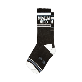 front view of two black socks with "museum nerd" in white on the top of the socks.