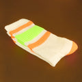 Close-up shot of Bobby socks folded neatly, highlighting the texture and vibrant stripes. [lf]