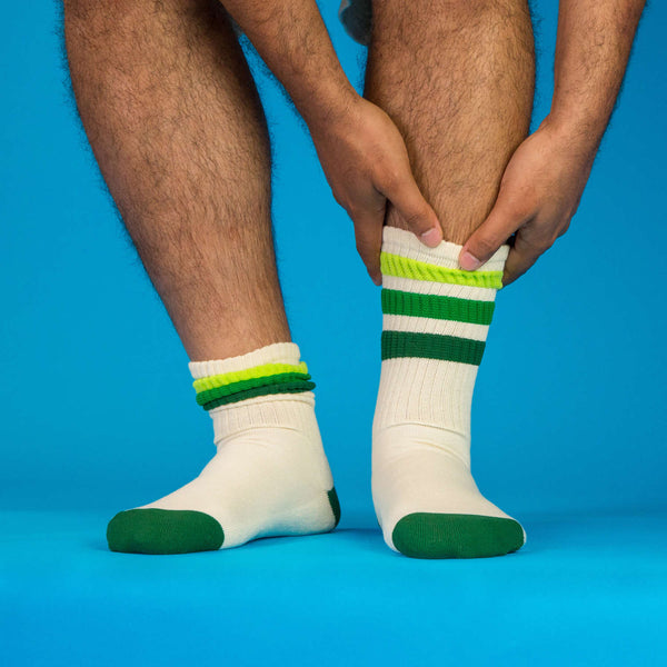 Lifestyle shot of a person wearing the Greg socks, showcasing the fit and style. [lf]