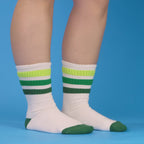Folded Greg sock on brown background, showing folded texture and color [lf]