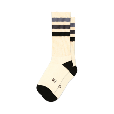 front view of a pair of off-white socks with black and gray stripes.