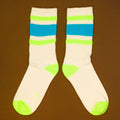 Flat lay product shot of Peter socks on a brown background, showcasing the top of the socks. [lf]
