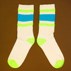Flat lay product shot of Peter socks on a brown background, showcasing the top of the socks. [lf]