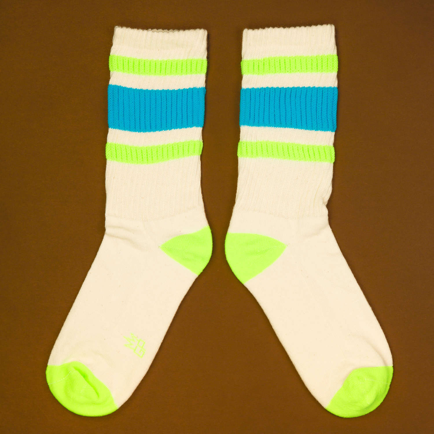 Flat lay product shot of Peter socks on a brown background, showcasing the top of the socks. [lf]