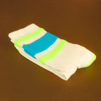 Close-up of Peter socks folded on a brown surface. [lf]