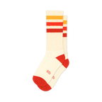 Pair of cream crew socks with red, orange, and yellow horizontal stripes. Red accents at the heel and toe. Small logo on the bottom.