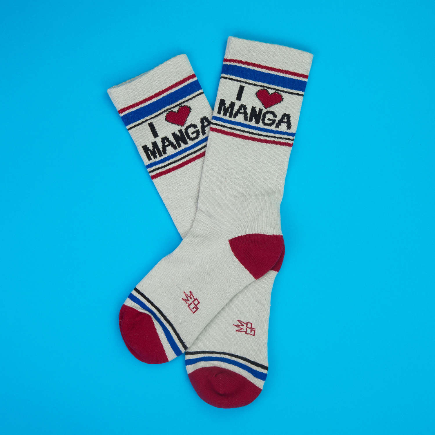 Flatlay of 'I Heart Manga' crew socks on a blue background.