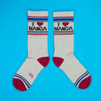 Pair of 'I Heart Manga' socks laid flat on a bright blue surface.