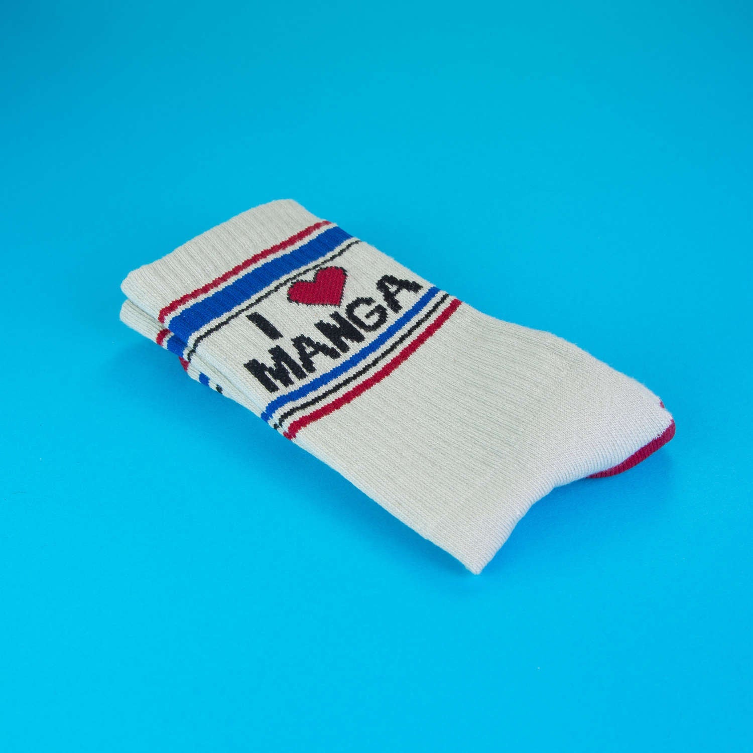 Close-up of folded 'I Heart Manga' socks, showcasing the design.